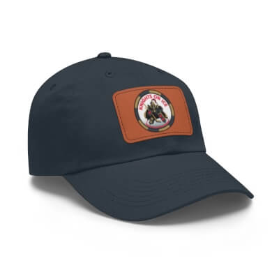 A product image of a dark baseball cap with a leather patch containing the knights on ice logo
